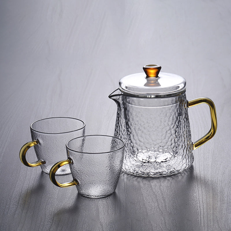 Elegant Varmebestandig Glas Teapot med Gyldent Håndtag og Si